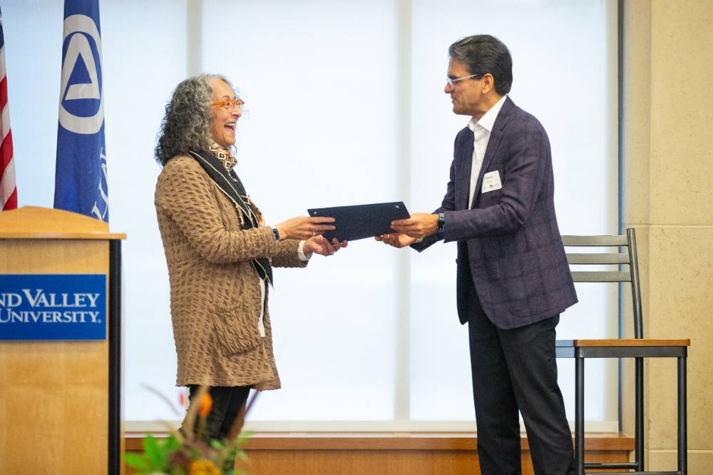 Seidman Dean, Diana Lawson presents a gift in honor of Milind Pant, CEO of Amway